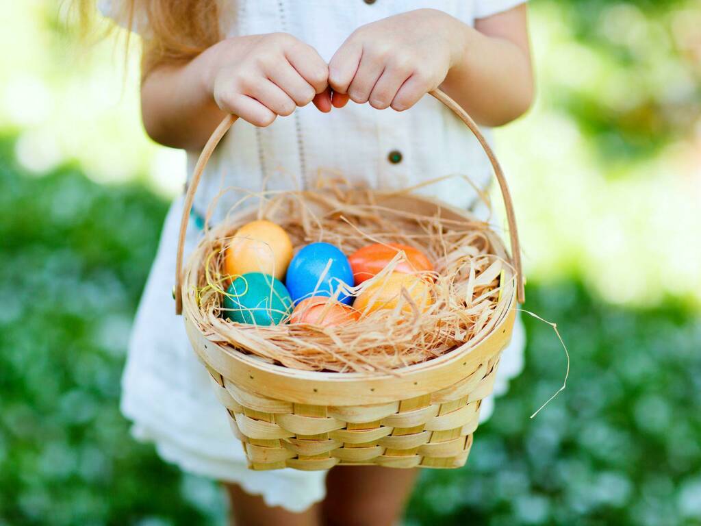 Girl holding Easter egg basket